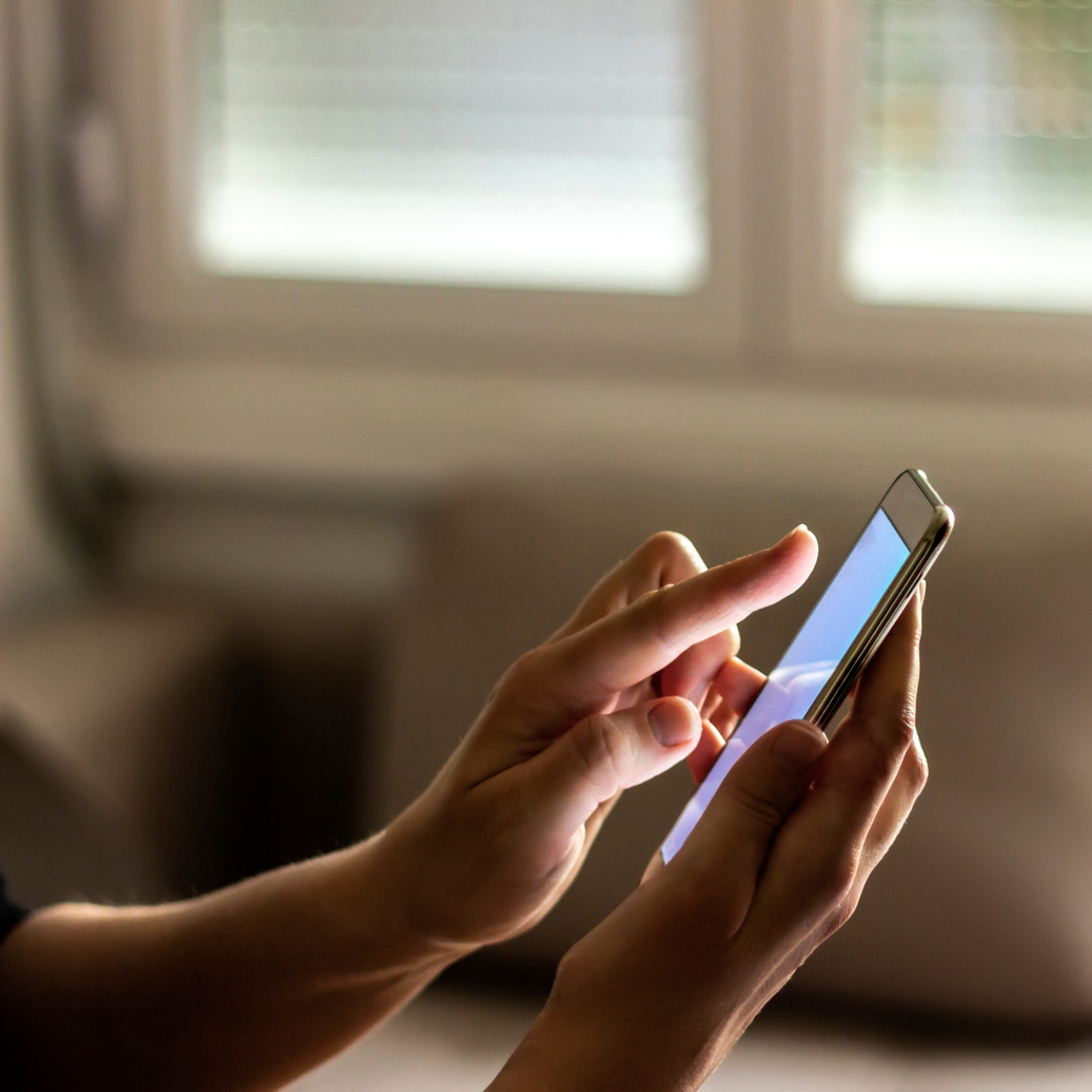 Woman using cell phone.